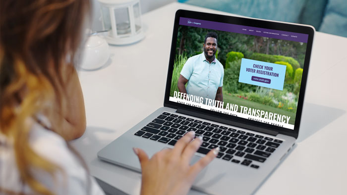 Image of a laptop with the Nick for Congress campaign website on it