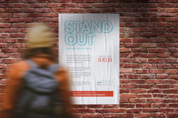 White poster with 'Stand Out' shadow on top