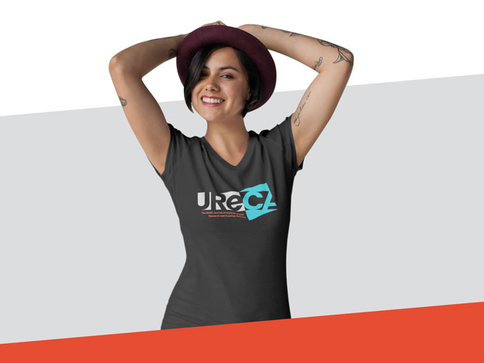 An image of the UReCA shirt, which is a deep grey with the logo on the front