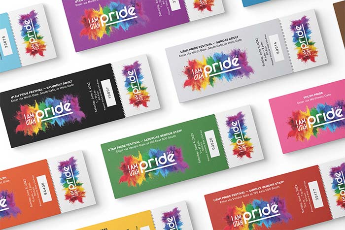 Several tickets in different colors sitting on a table