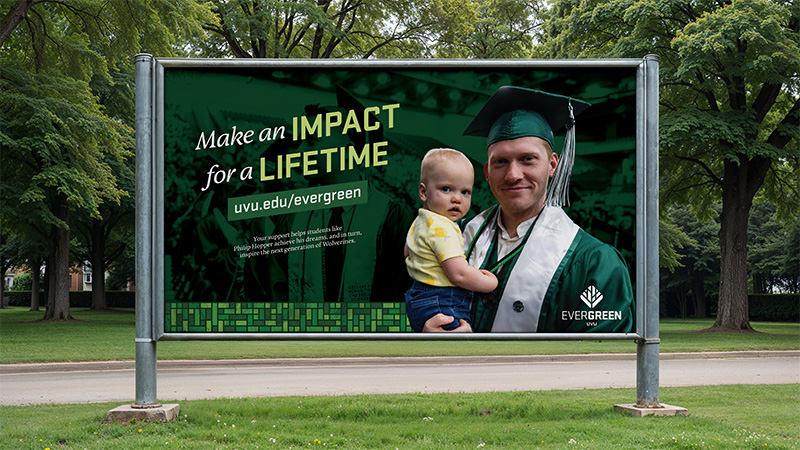 Mockup of a billboard with a large image of a graduate and their child