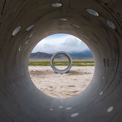A view of the Sun Tunnels in norhtern Utah framed by a different tunnel